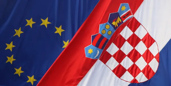 Close up EU and Croatian flags — Stock Photo, Image