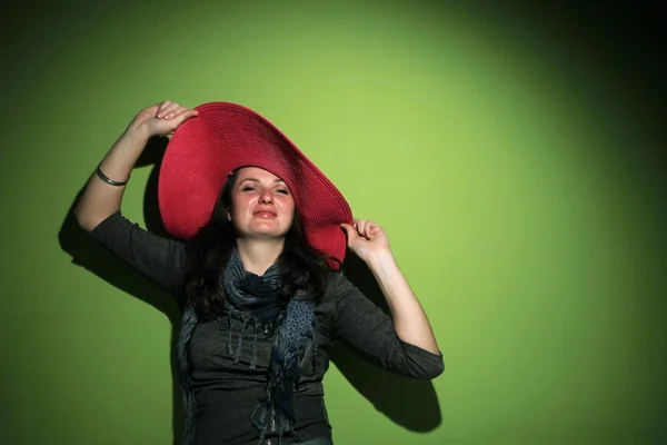 Pretty brunette with hat — Stock Photo, Image