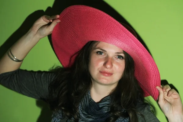 Brunette with pinky hat Stock Image