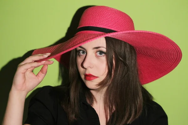 Girl with pink straw hat — Stock Photo, Image