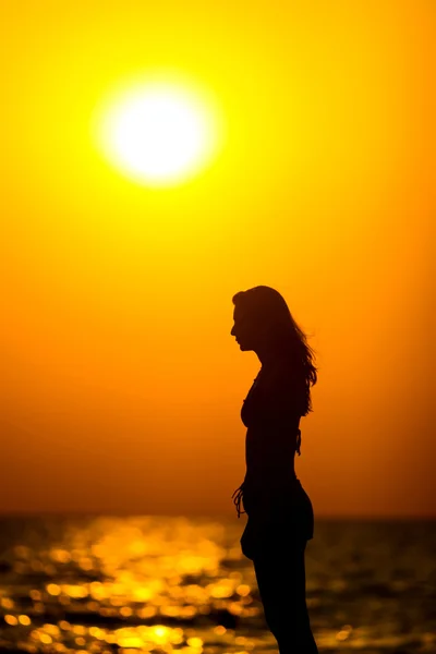 Woman silhouette at sunset — Stock Photo, Image