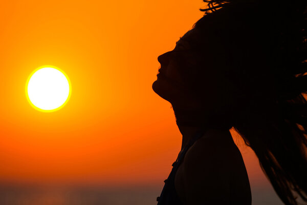 Young woman at sunset