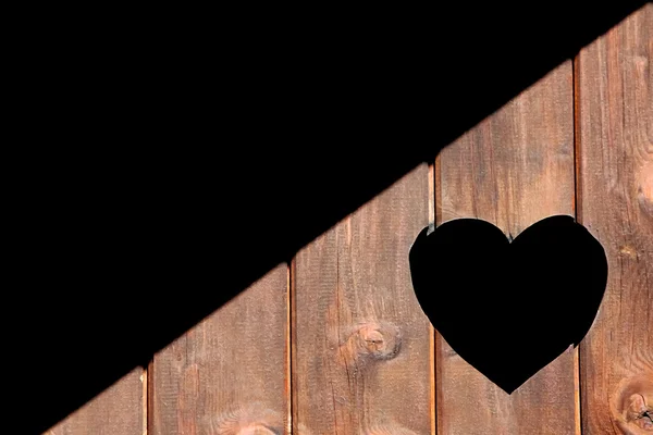 A forma di cuore in porta di legno — Foto Stock
