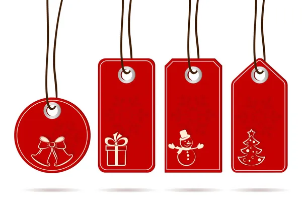 Set de etiquetas rojas colgantes con motivos navideños blancos — Vector de stock