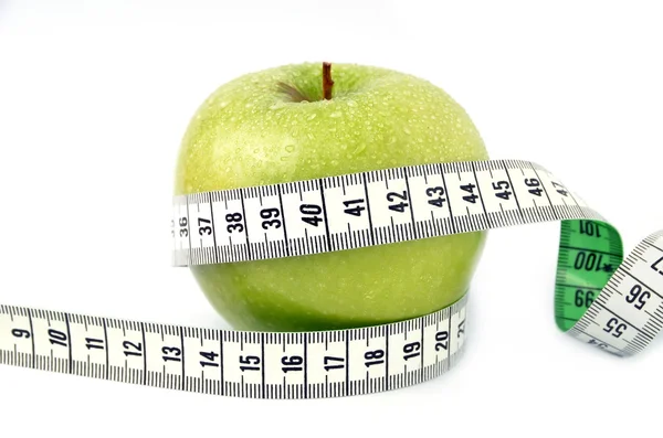 Green apple with measuring tape isolated on white background — Stock Photo, Image