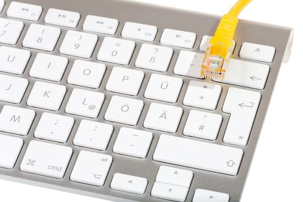 Modern keyboard and Network cable — Stock Photo, Image