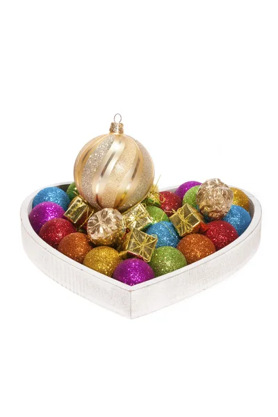 Wooden tablet with christmas baubles — Stock Photo, Image