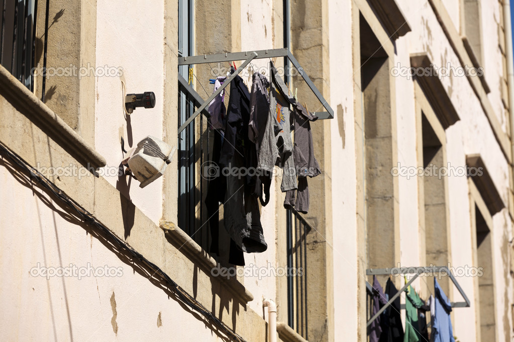 A drying rack in front of a window