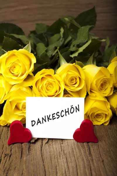 Flower and a card "Dankeschoen" — Stock Photo, Image