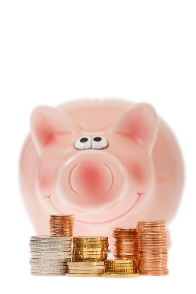 Pink piggy bank and euro coins — Stock Photo, Image