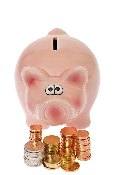 粉红猪存钱罐和欧元硬币 — 图库照片