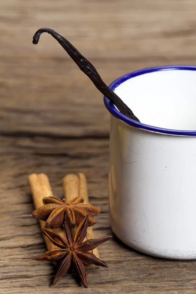 Vanilla in enamel cup — Stock Photo, Image