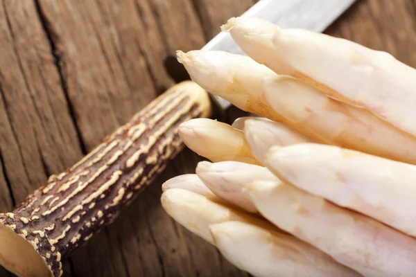 Asparagus tips and knife — Stock Photo, Image