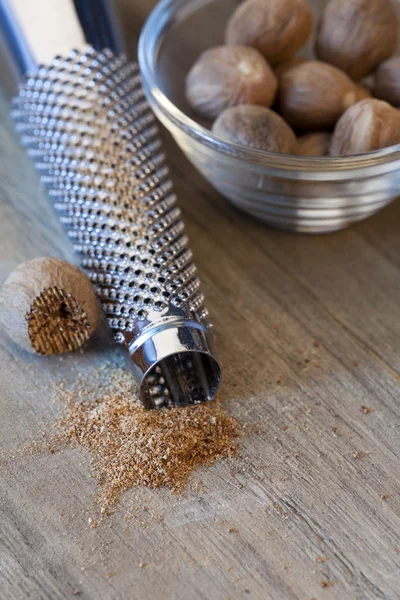 Nutmeg with grater — Stock Photo, Image