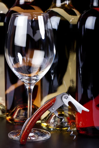 Wine glass, wine bottle and corkscrew — Stock Photo, Image