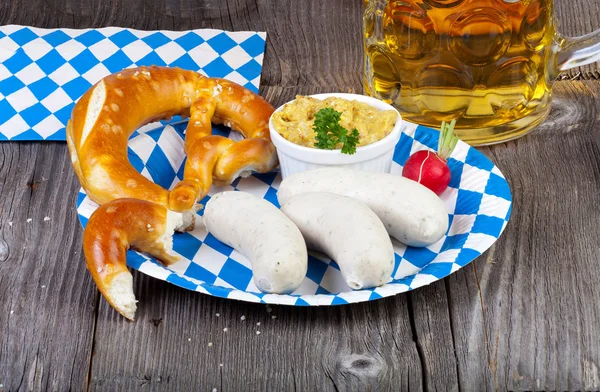 Veal sausage and pretzel on a paper plate — Stock Photo, Image