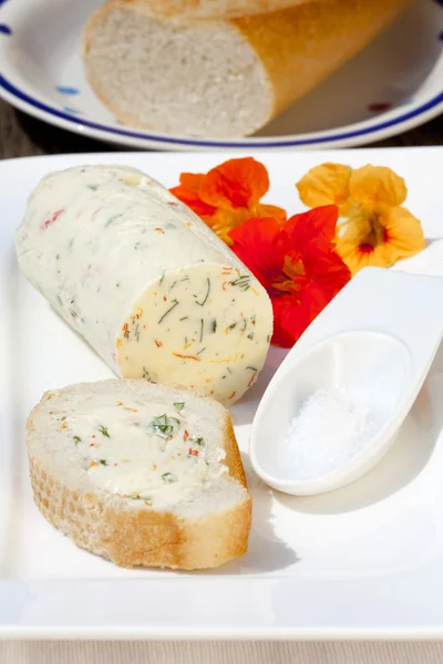 Nasturtium herb butter on baguette — Stock Photo, Image