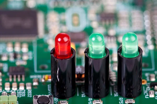 Three LEDs in sockets on a circuit board — Stock Photo, Image