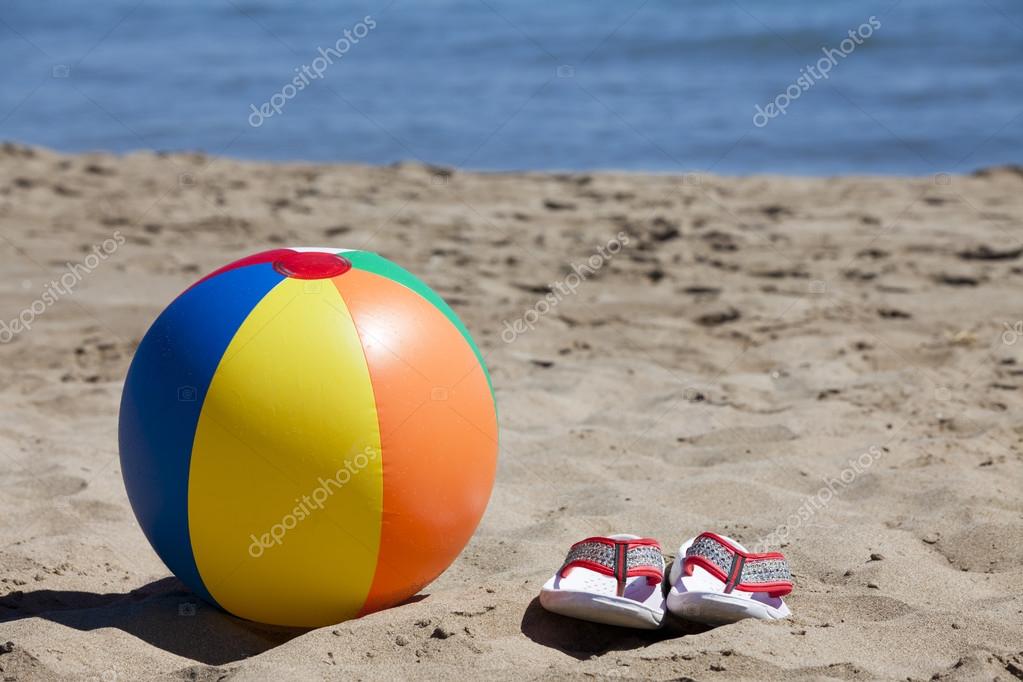 Beach Ball and Flip-Flops in the Sand — Stock Photo © TKphotography