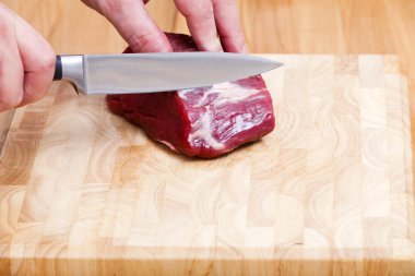 Raw Beef Tenderloin on Cutting Board clipart