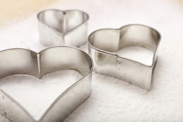 Cookie cutter in heart shape — Stock Photo, Image
