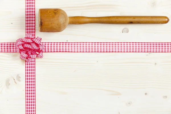 Wood masher on a wooden board — Stock Photo, Image