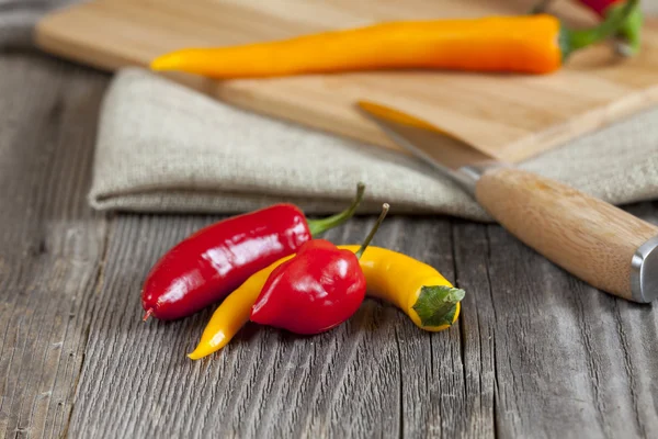 Close up of three chili peppers — Stock Photo, Image