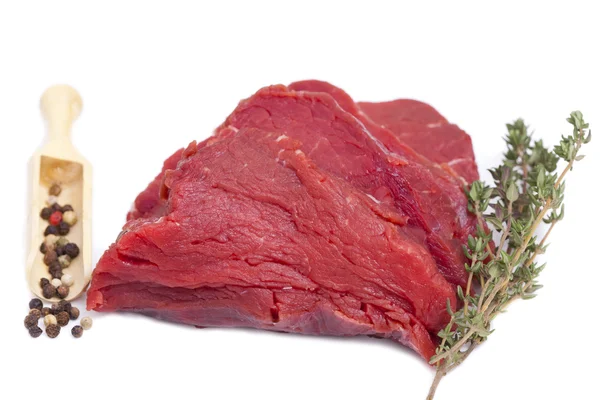 Piece Beef Tenderloin with a twig Thyme and Peppercorns — Stock Photo, Image