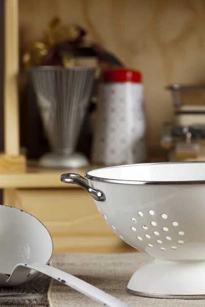 Ladle is next to a colander — Stock Photo, Image