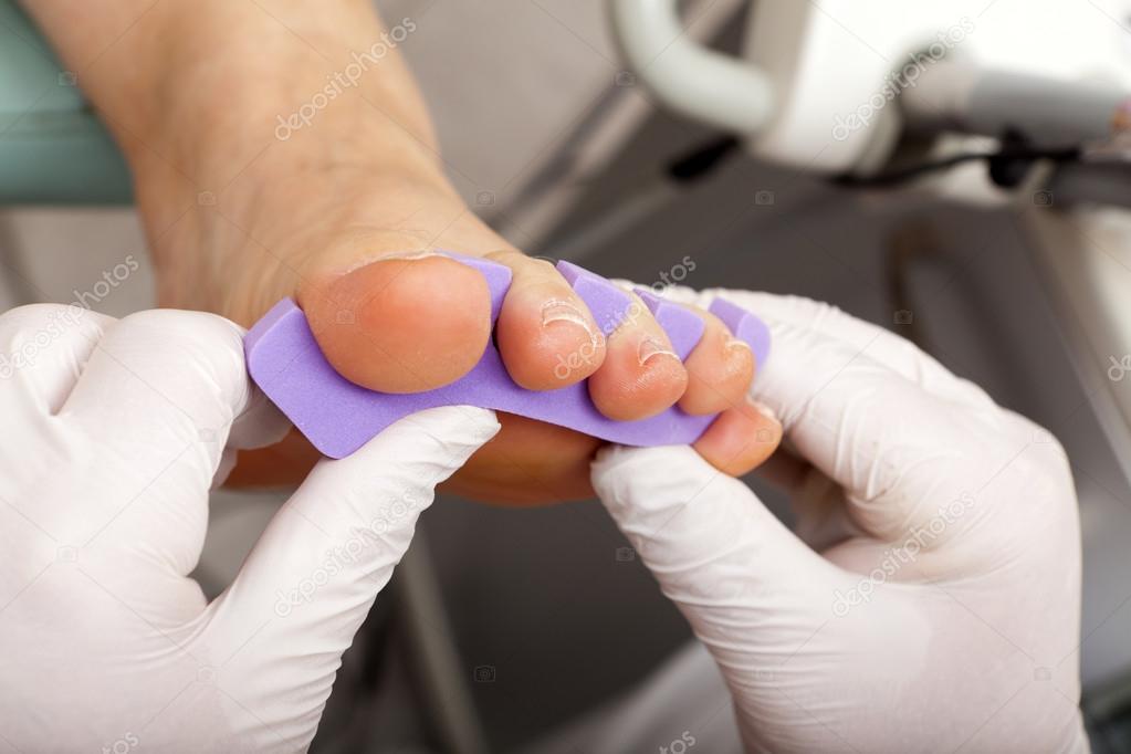 Toe Divider at the foot of a woman
