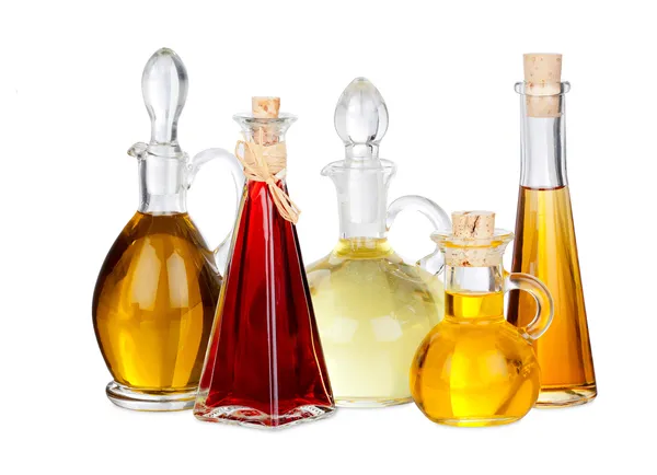 Vários óleos de cozinha em garrafas de vidro — Fotografia de Stock