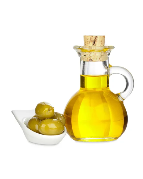 Jarra de vidrio con aceite de oliva y aceitunas en un tazón —  Fotos de Stock