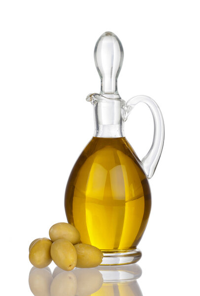 Glass carafe with olive oil, Olives and real reflection