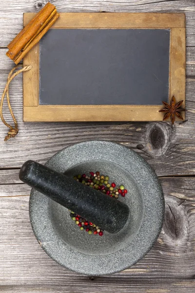Mortar with pestle and for labeling a slate — Stock Photo, Image