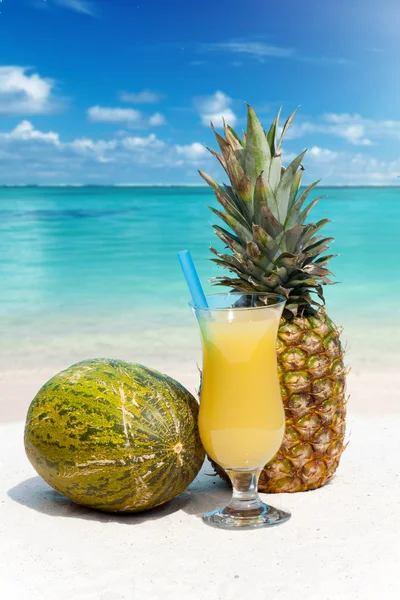 Pineapple, melon and a cocktail — Stock Photo, Image