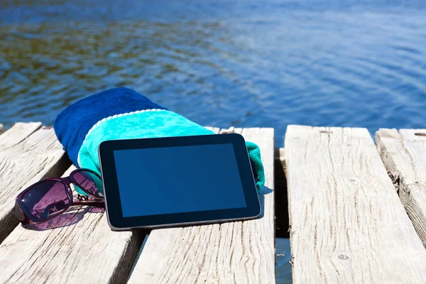 With a Tablet PC on the lake — Stock Photo, Image