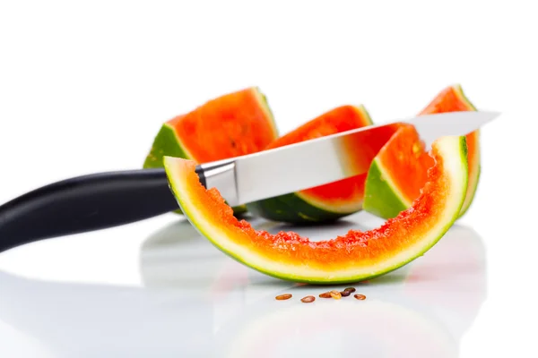 Kitchen knife stuck in a piece of watermelon — Stock Photo, Image