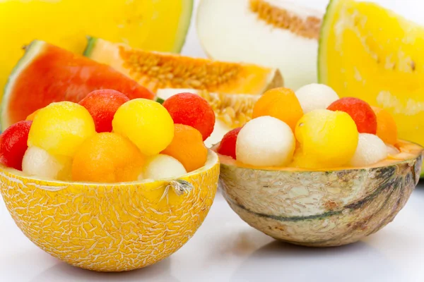 Melon as a bowl for melon balls — Stock Photo, Image