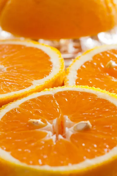 Juicy halved oranges as closeup — Stock Photo, Image
