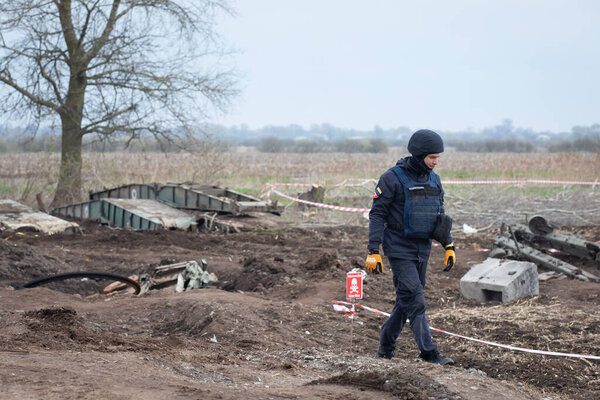 Ukrainian rescuers clear mines at the site of recent fighting between the Russian and Ukrainian armies in Kyiv region, Ukraine. April 21, 2022.
