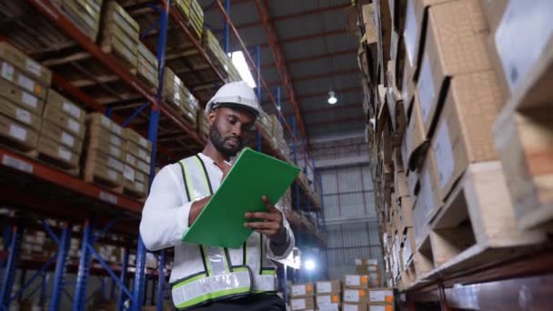 Business Concept Resolution African Man Checking Goods Warehouse — Stock Video