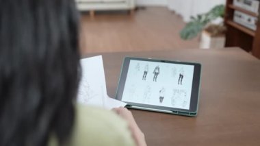 4k Kararlılığın iş konsepti. Ofiste çalışan Asyalı kadın tasarımcı. Çevrimiçi oyunlarda giysi ve karakter tasarımı.