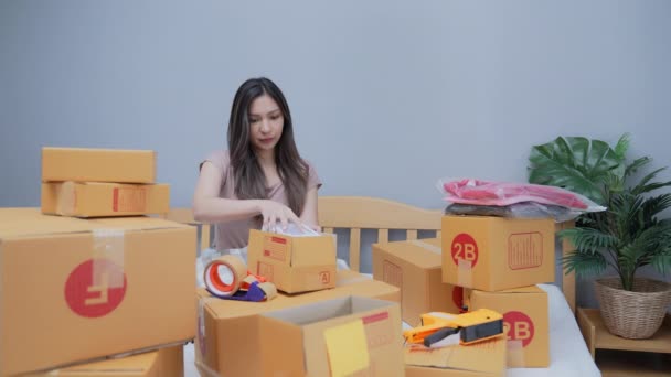 Business Concept Resolution Asian Woman Packing Products Boxes Home Delivery — Stock Video