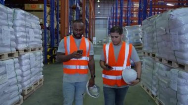 Business concept of 4k Resolution. Employees are walking and talking in a warehouse.