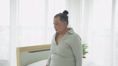 Exercise concept of 4k Resolution. Asian elderly woman exercising at home.