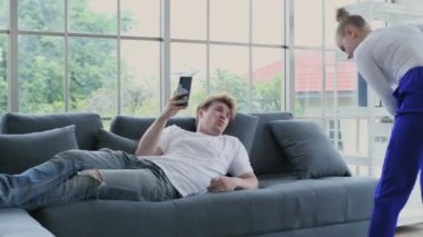 Family concept of 4k Resolution. Caucasian couple cleaning in the house. taking advantage.