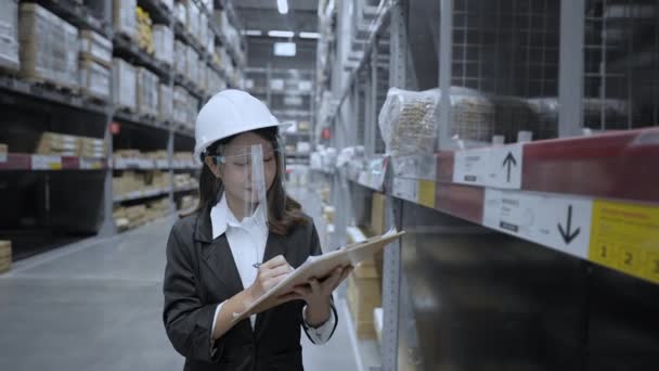 Business Concept Resolution Asian Women Intently Inspecting Items Warehouse — Stock Video