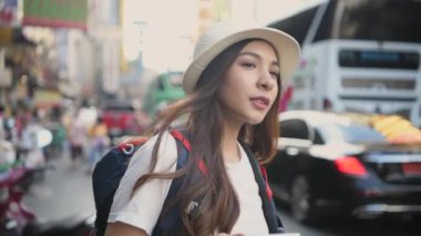Travel concept of 4k Resolution. Asian woman using phone on the road while traveling.