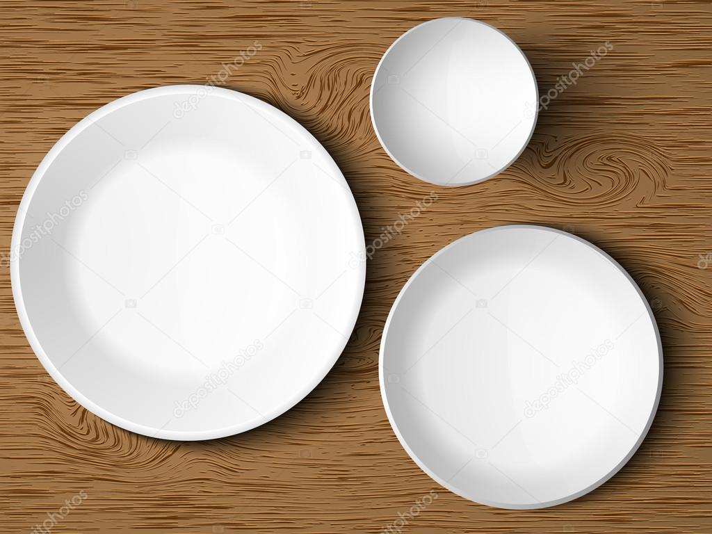 A set of white dishes on a wooden table