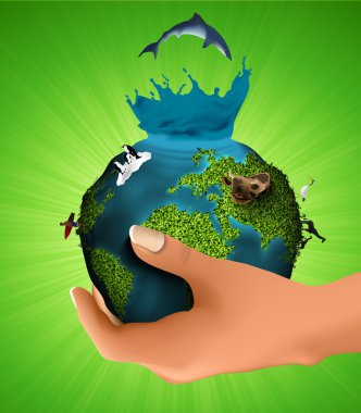 Green planet with the animals in his hand. concept of ecology